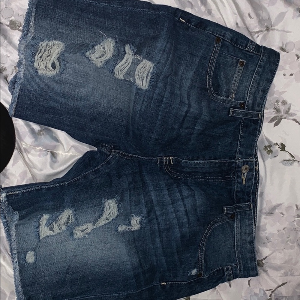 Medium length ripped shorts